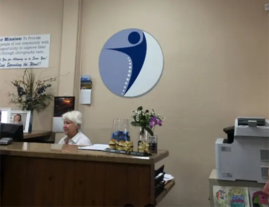 atlas chiro staff working behind main office desk